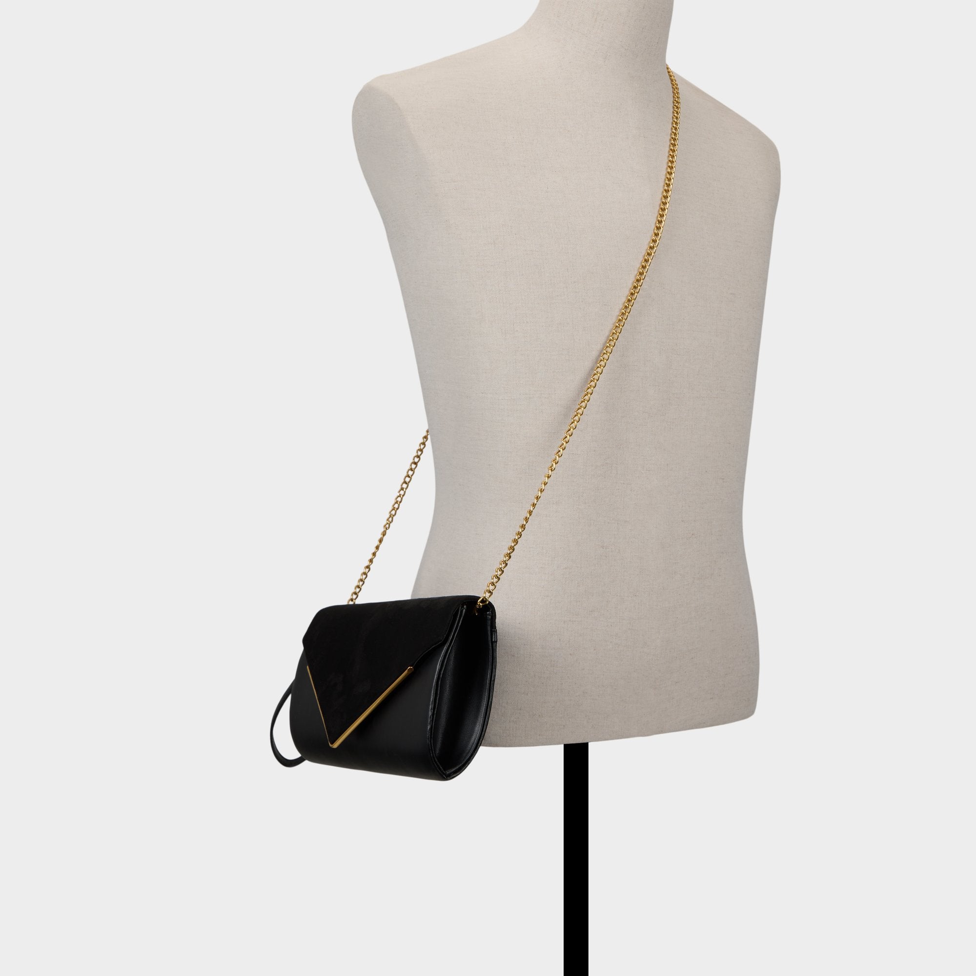 ALDO Serpantee pochette noire chaîne dorée