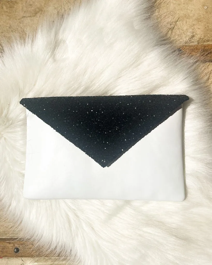Dessine Moi Un Soulier pochette cuir blanc glitter noir